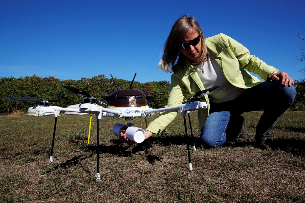 Helen Greiner, founder of CyPhy Works, catches a UPS package carried by a CyPhy Works drone to Children's Island off the coast of Beverly, Massachusetts, U.S. September 22, 2016, during UPS's demonstration of a drone making a commercial delivery of a package to a remote or difficult-to-access location. Picture taken September 22, 2016. REUTERS/Brian Snyder